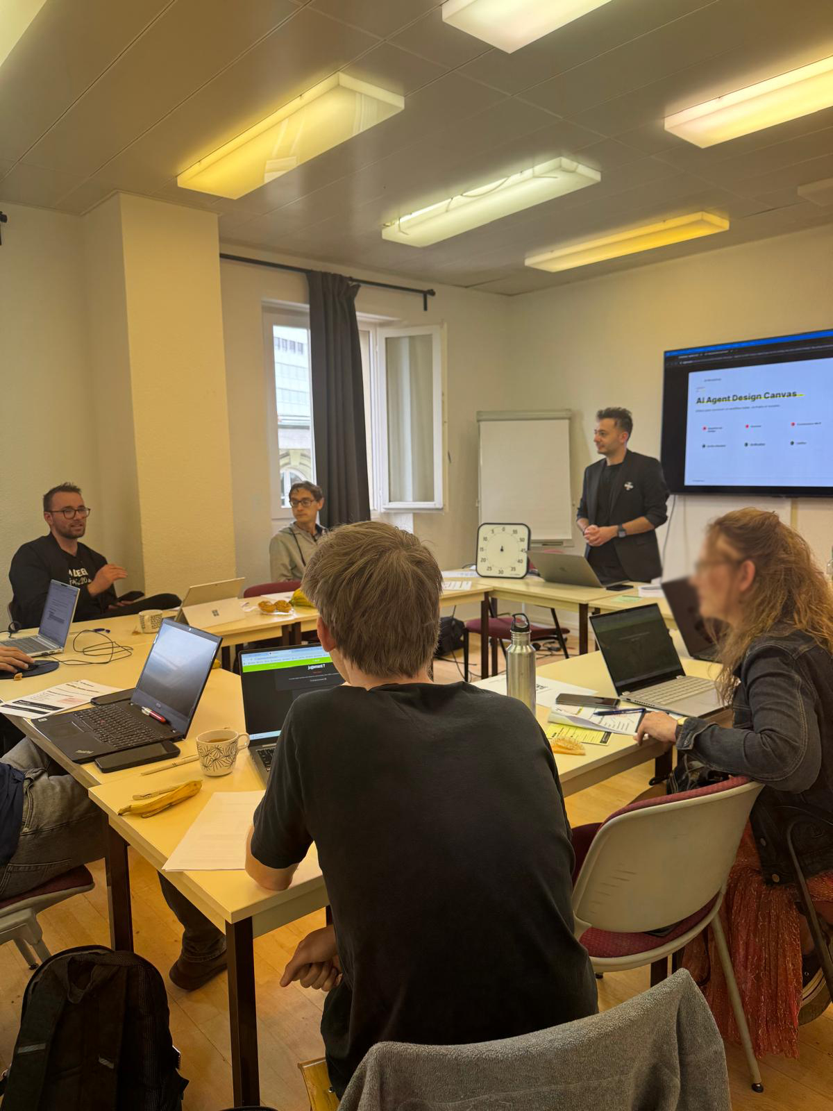 Agentic AI workshop in Lausanne with participants working around the Agent Design Canvas